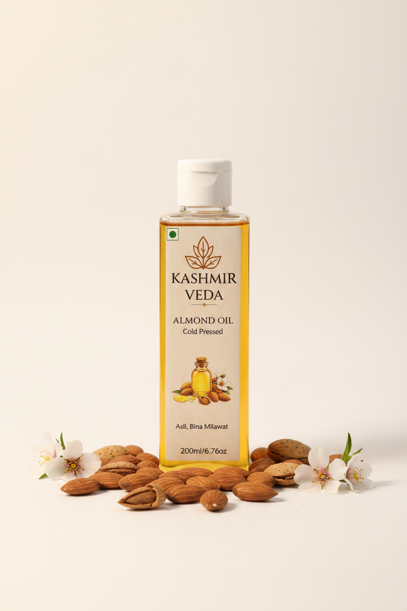Kashmir Veda Cold Pressed Almond Oil bottle with almonds and almond flowers on white background